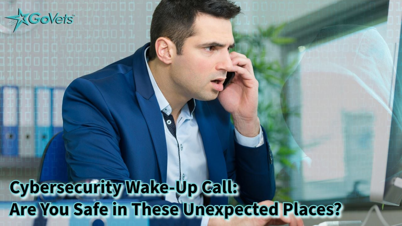 Cybersecurity wake-up call - man on phone examining hacked computer systems with hacker in the background